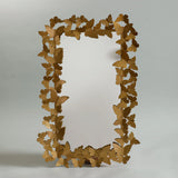 Adorned with a delicate and intriguing metal frame